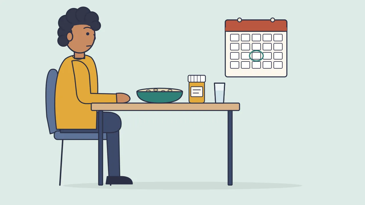 An adult sits at a table with a bowl of oatmeal, a small supplement bottle and a glass of water, below a wall calendar with one day circled
